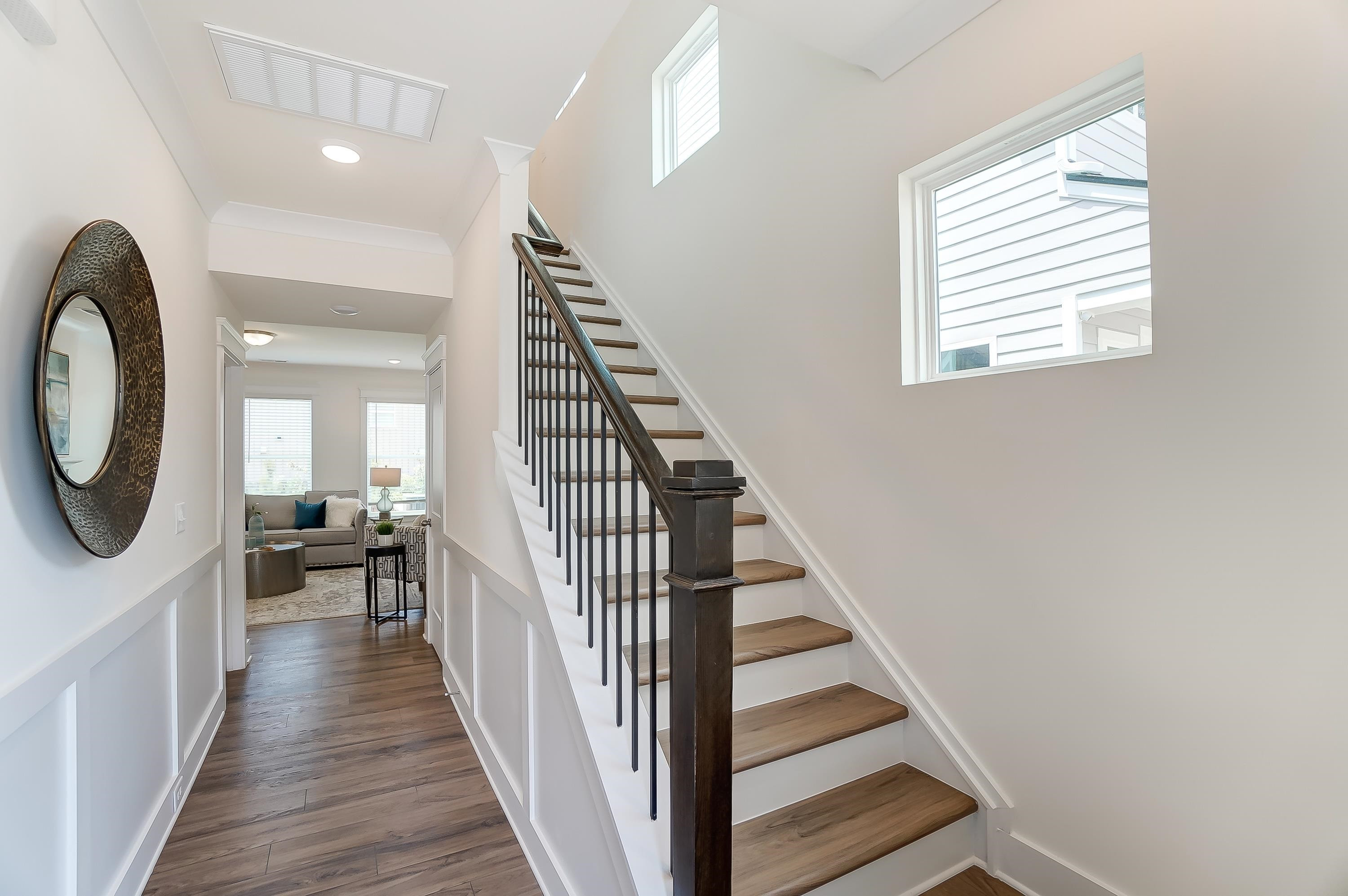 3450 Piedmont Drive Raleigh, NC 27604 - Photo 3 of 34 a view of a hallway with wooden floor and staircase