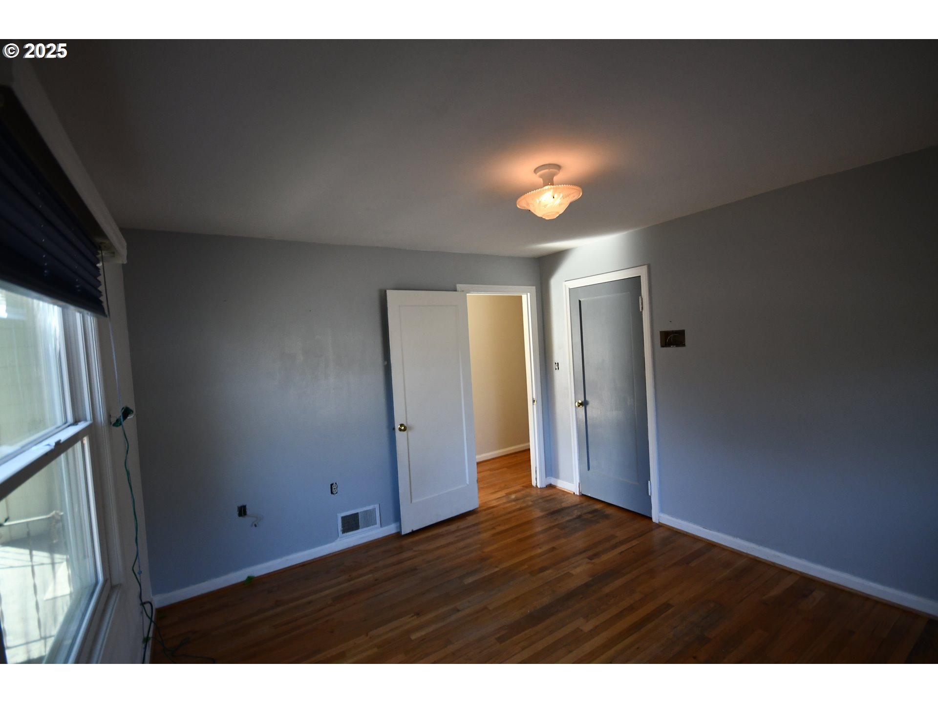 4233 Chenoweth Road The Dalles, OR 97058 - Photo 13 of 46 a view of empty room with wooden floor and fan