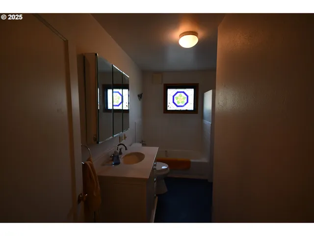 a bathroom with a sink and mirror
