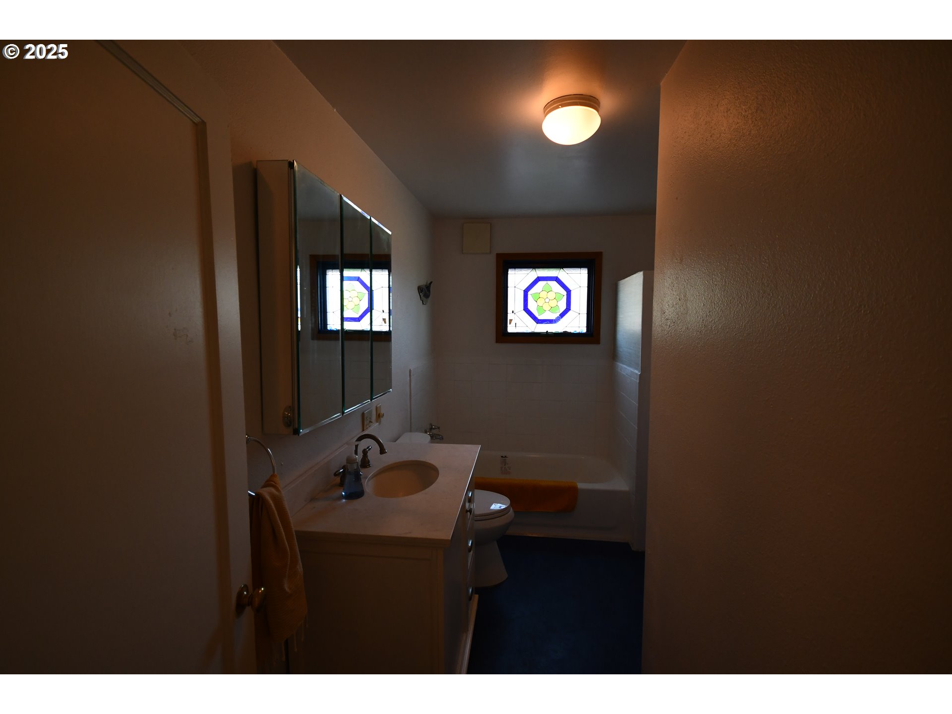 4233 Chenoweth Road The Dalles, OR 97058 - Photo 14 of 46 a bathroom with a sink and mirror