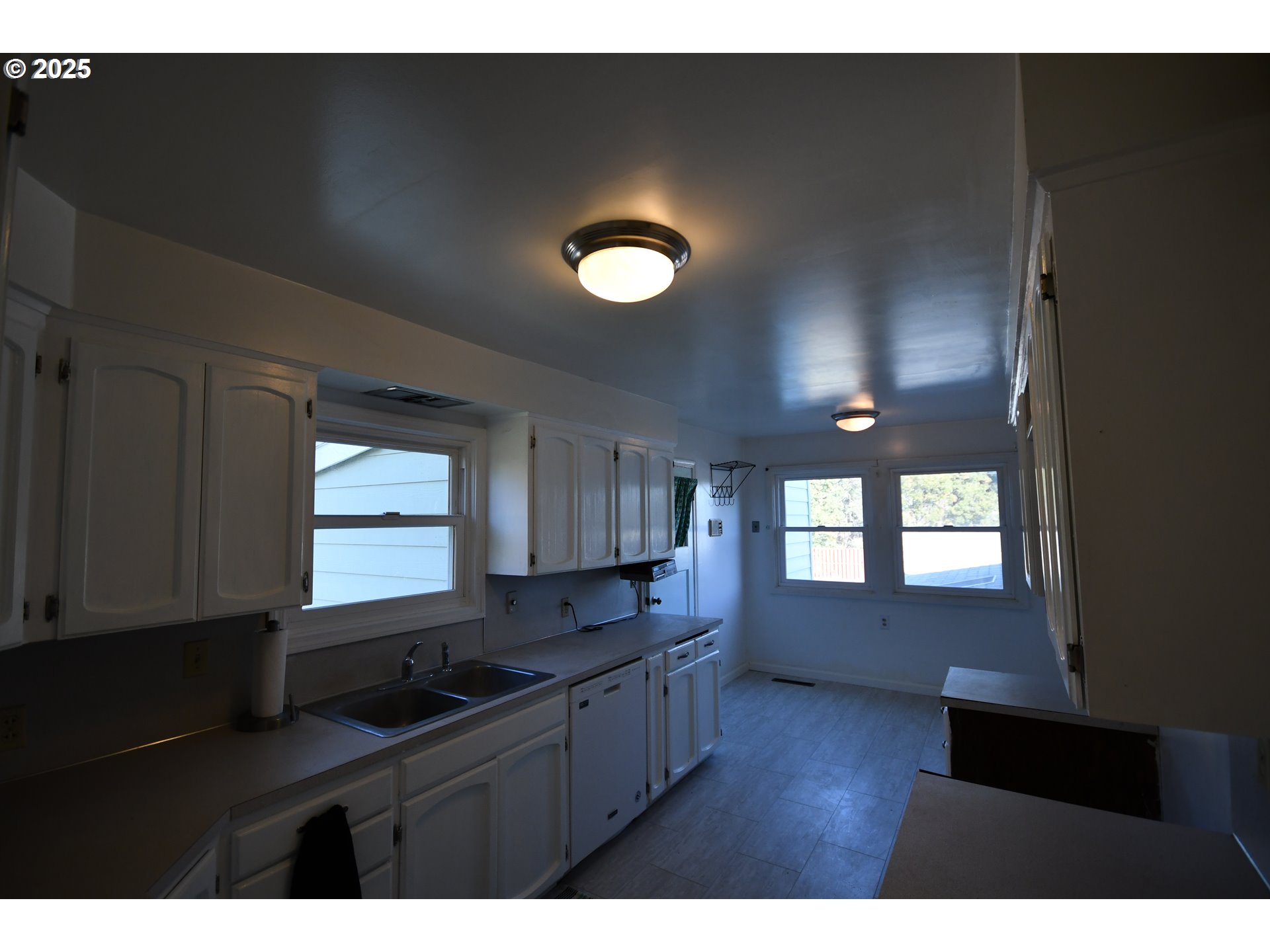 4233 Chenoweth Road The Dalles, OR 97058 - Photo 16 of 46 a kitchen with refrigerator and window
