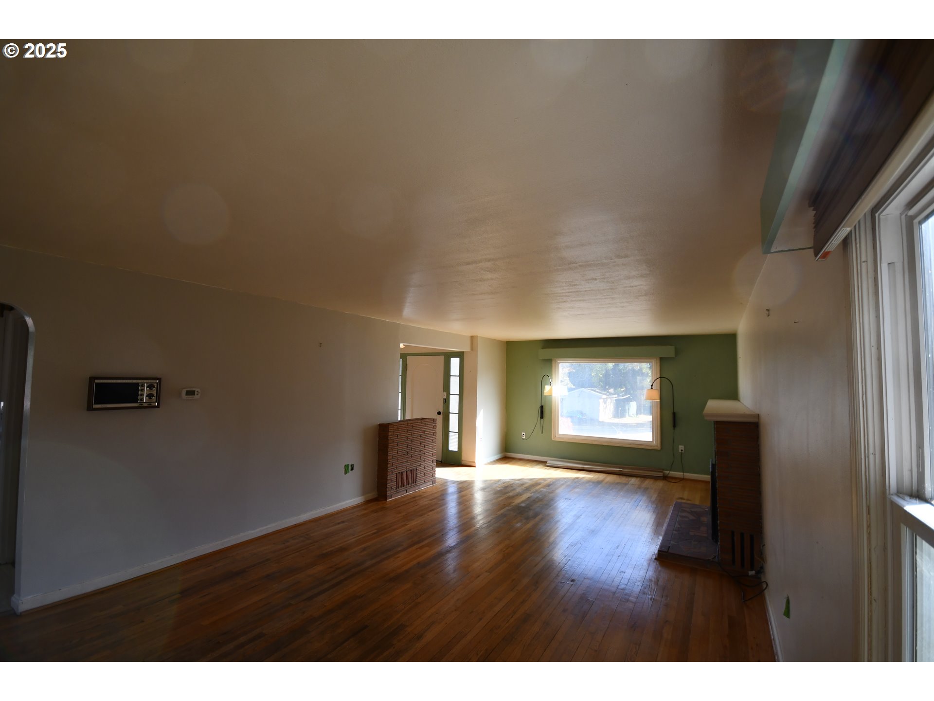 4233 Chenoweth Road The Dalles, OR 97058 - Photo 20 of 46 a view of an empty room with window and wooden floor