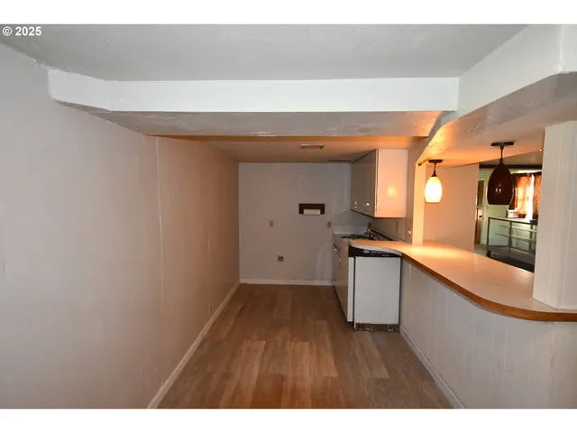 a kitchen with a wooden floor