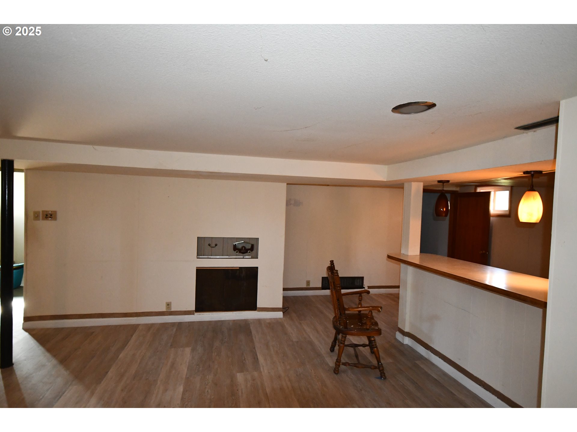 4233 Chenoweth Road The Dalles, OR 97058 - Photo 26 of 46 a room with wooden floor and windows