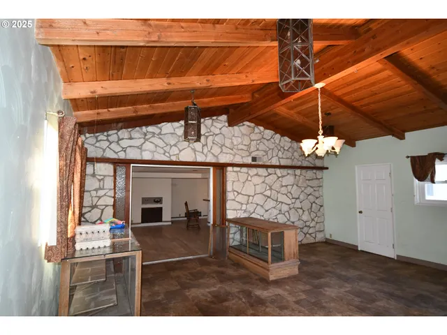 a bedroom with a bed and a fireplace