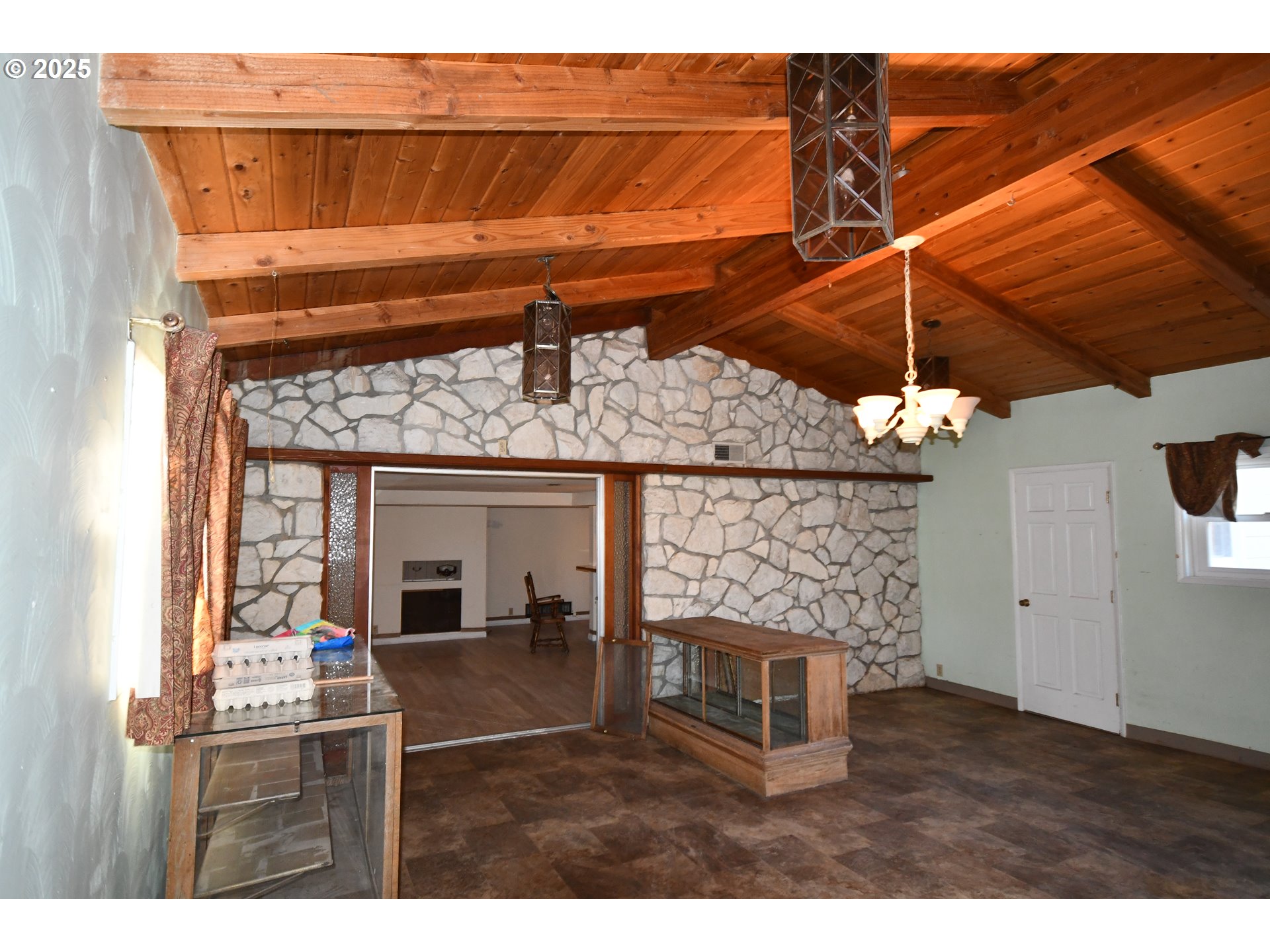 4233 Chenoweth Road The Dalles, OR 97058 - Photo 28 of 46 a bedroom with a bed and a fireplace