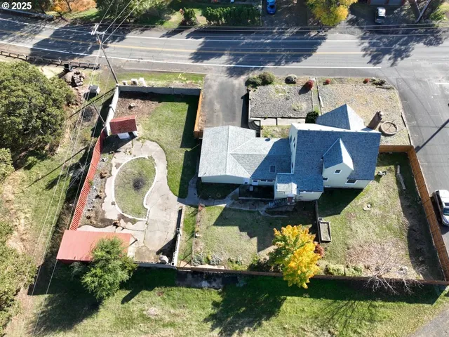 an aerial view of residential houses with outdoor space