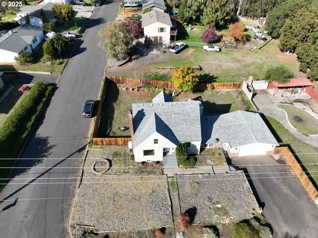 an aerial view of residential houses with outdoor space
