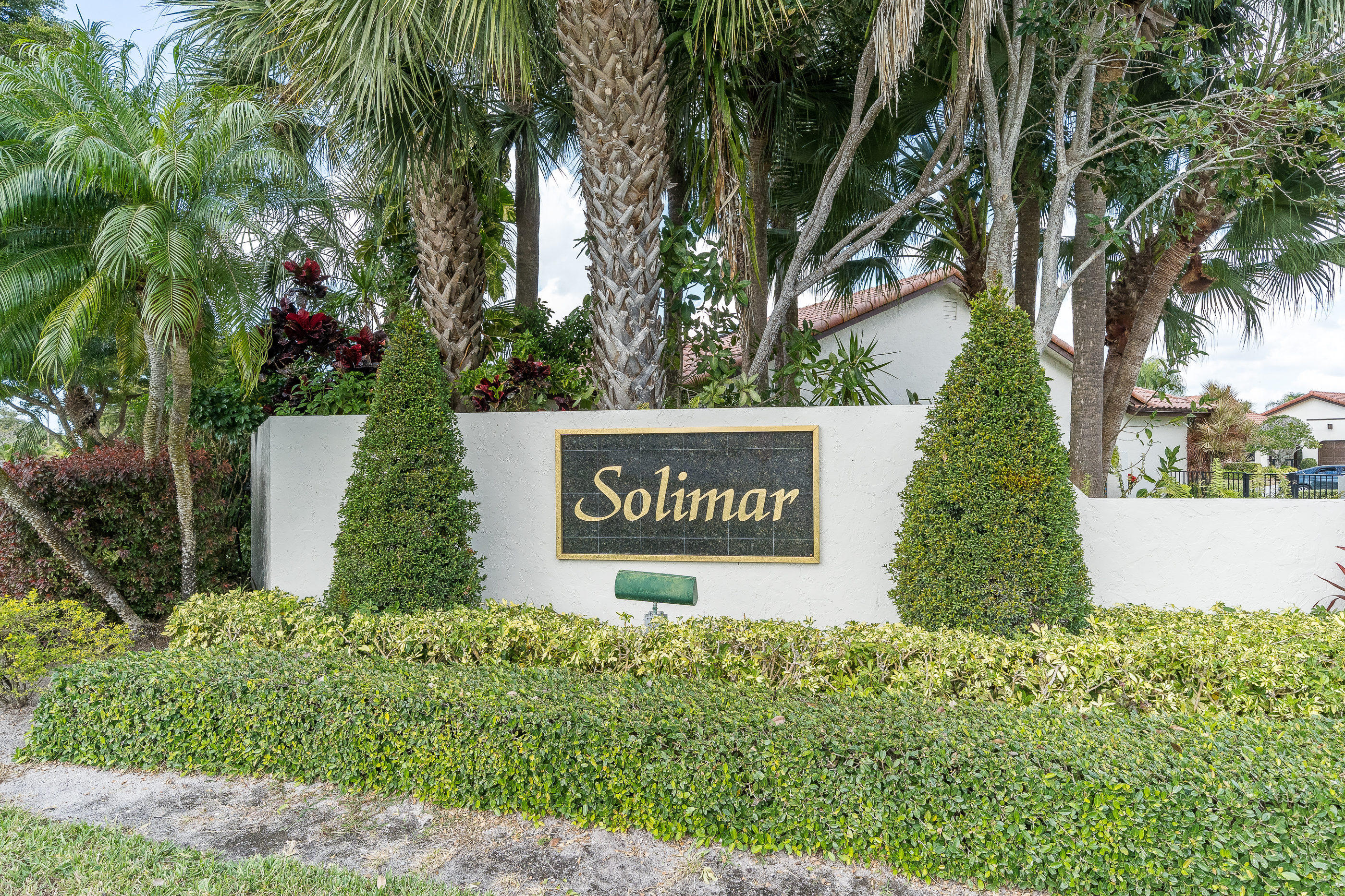 7723 Solimar Circle Boca Raton, FL 33433 - Photo 39 of 40 a sign broad in front of flowers