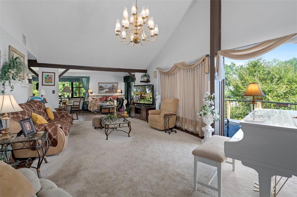 25927 Old Spring Lake Road Brooksville, FL 34601 - Photo 11 of 60 a view of a livingroom with furniture and a window