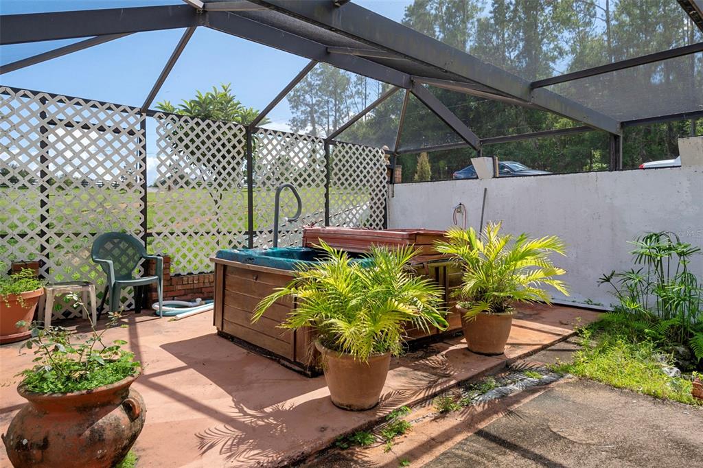 25927 Old Spring Lake Road Brooksville, FL 34601 - Photo 46 of 60 a potted plant sitting in front of a building