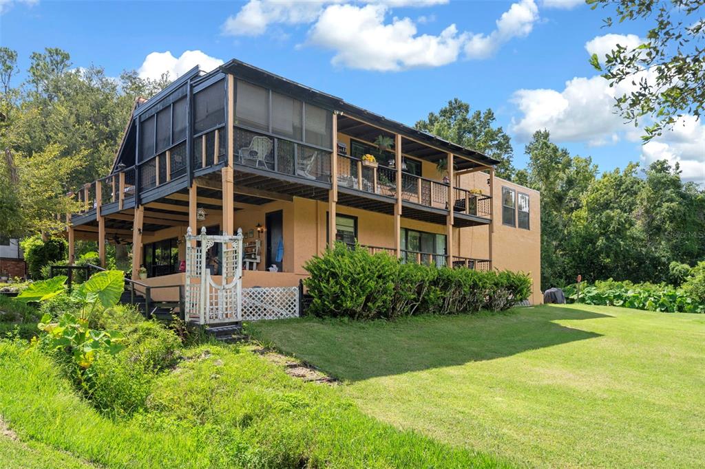 25927 Old Spring Lake Road Brooksville, FL 34601 - Photo 49 of 60 a view of a building with garden