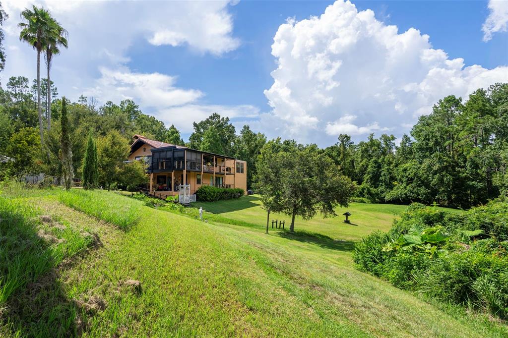 25927 Old Spring Lake Road Brooksville, FL 34601 - Photo 51 of 60 a view of a playground with basketball court