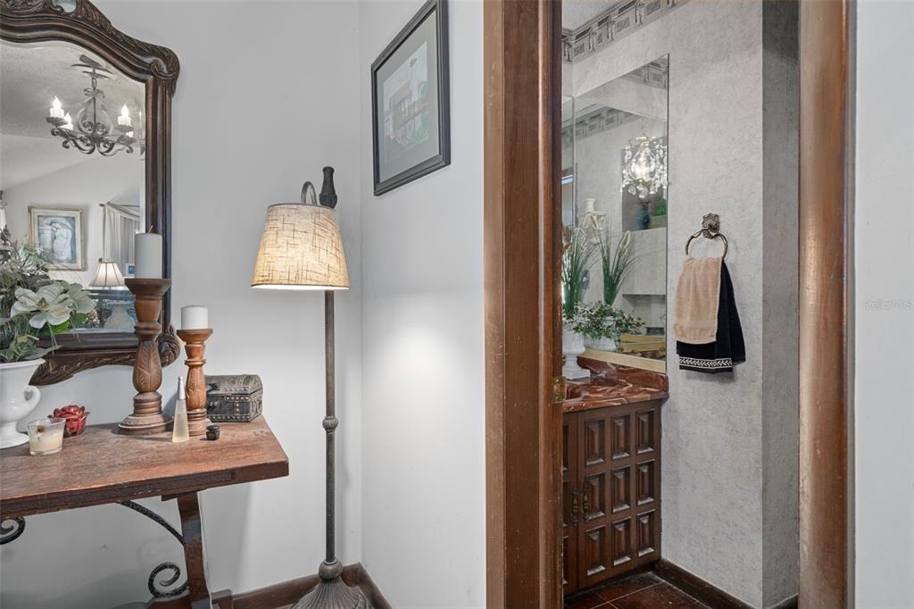 25927 Old Spring Lake Road Brooksville, FL 34601 - Photo 10 of 60 a view of a bathroom with a sink and mirror