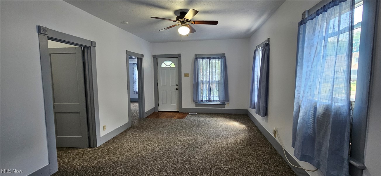 51 North Seneca Street Rittman, OH 44270 - Photo 6 of 17 Living room featuring carpet flooring and ceiling fan
