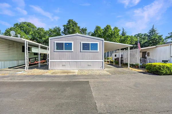 a front view of a house with a garage