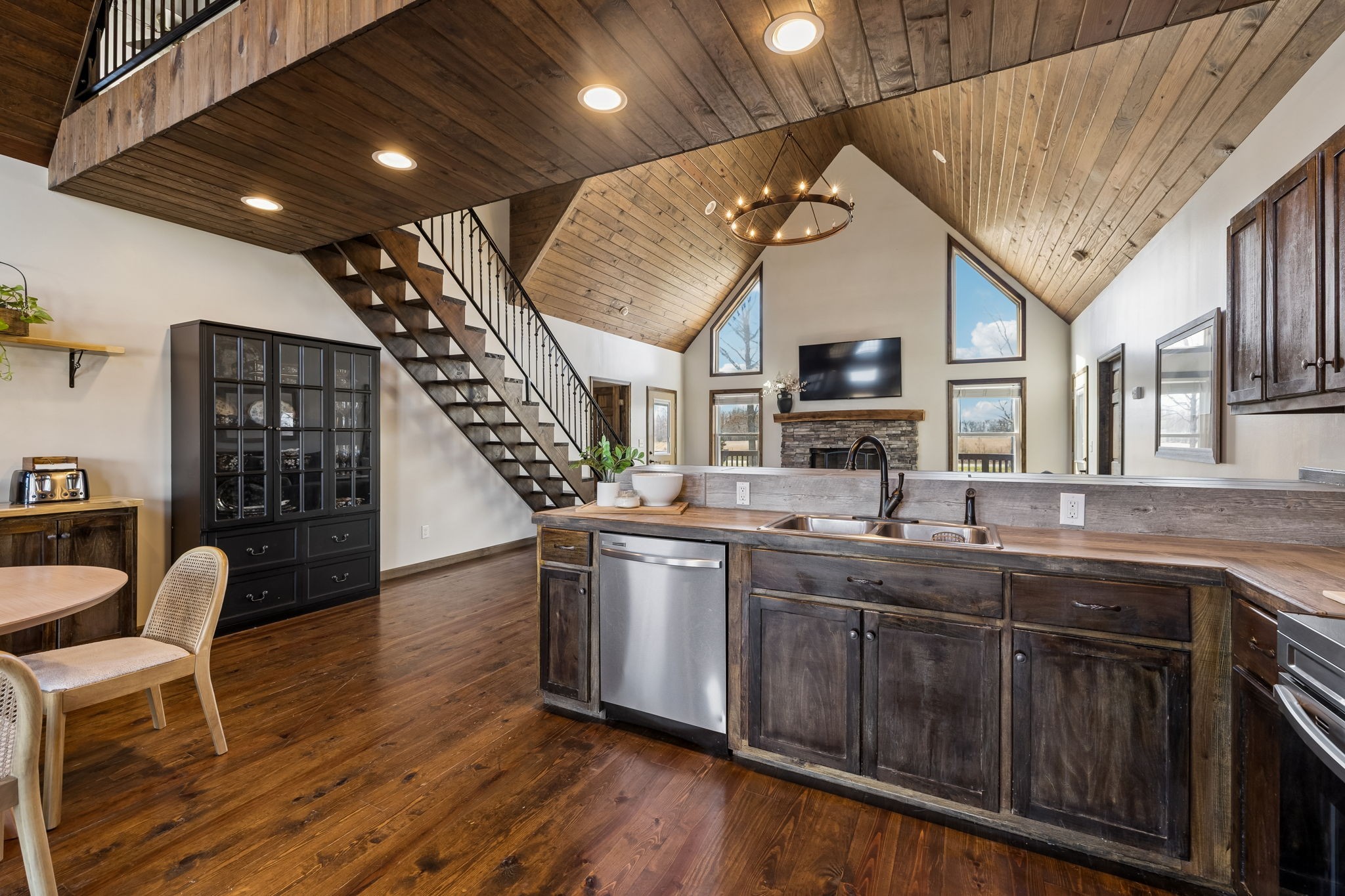 267 Switzerland Road Hohenwald, TN 38462 - Photo 18 of 98 a kitchen with sink cabinets and wooden floor