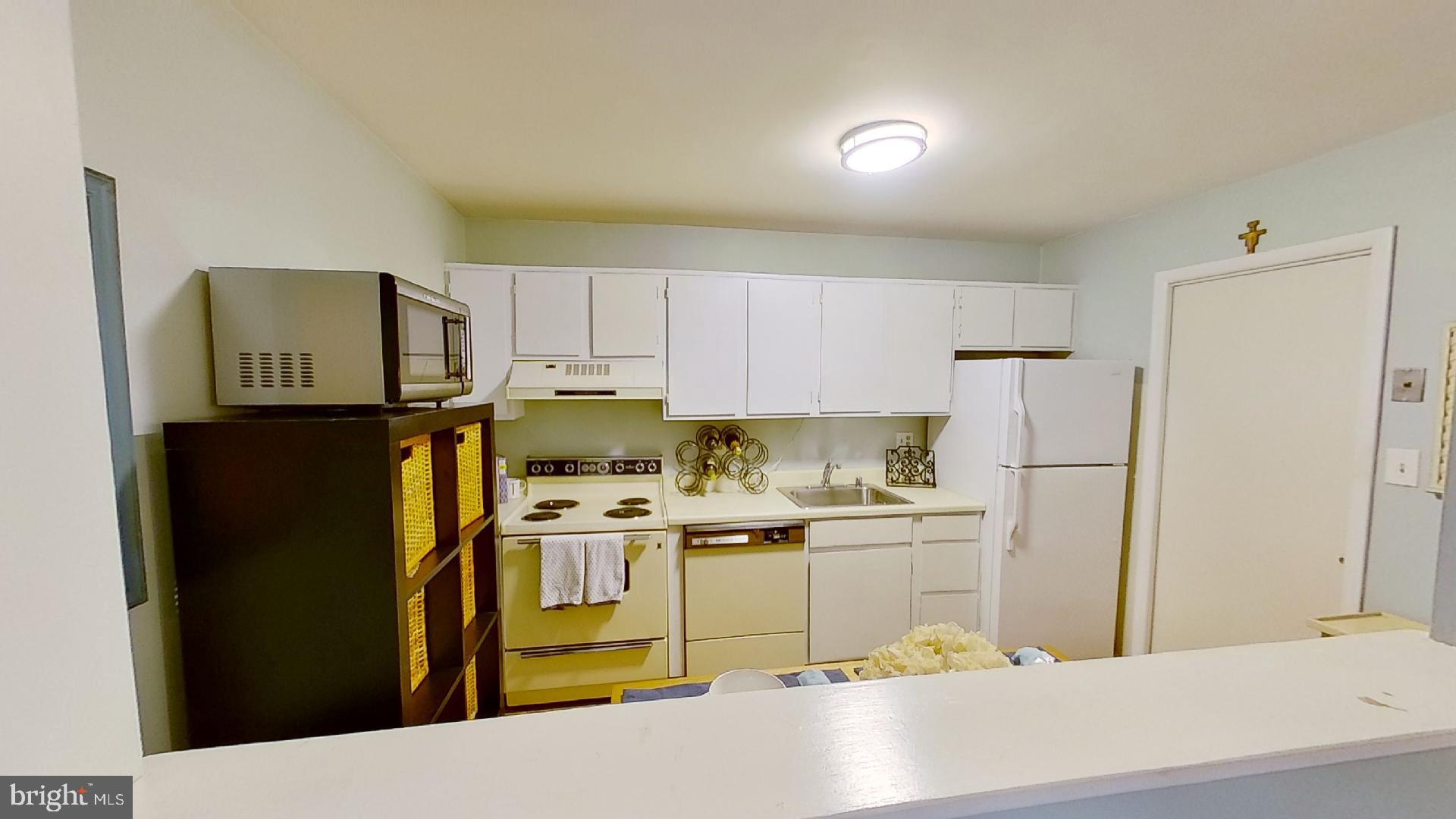 Open Kitchen w/White Cabinetry!