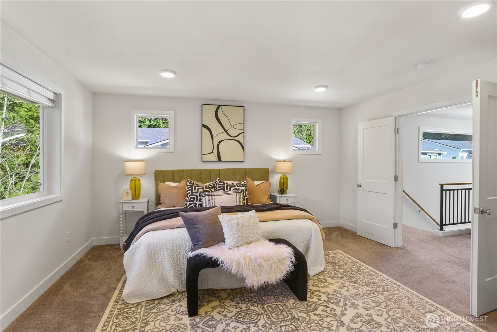 121 171st Place Southwest, Unit B Bothell, WA 98012 - Photo 24 of 36 a bedroom with a bed and painting on the wall