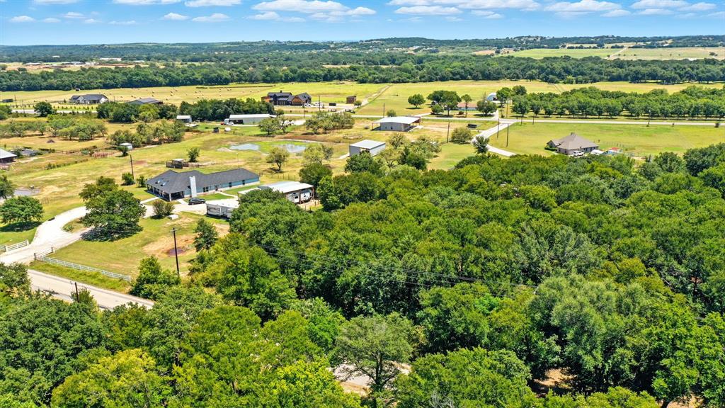 401 Taylor Road Weatherford, TX 76087 - Photo 4 of 9 Drone / aerial view of a heavily wooded area