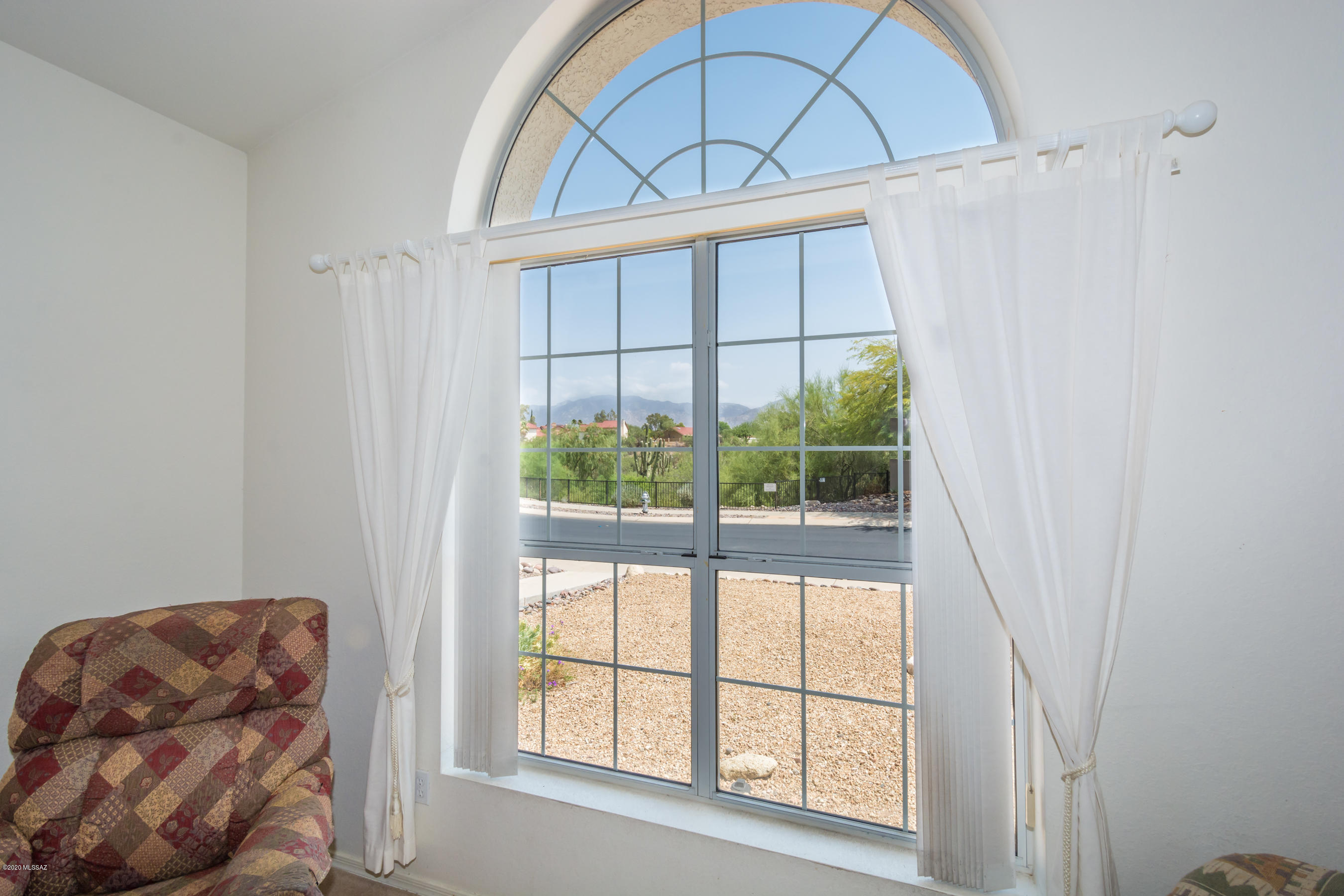 11341 Silver Pheasant Loop Oro Valley, AZ 85737 - Photo 12 of 41 a view of a livingroom with furniture and window in a room