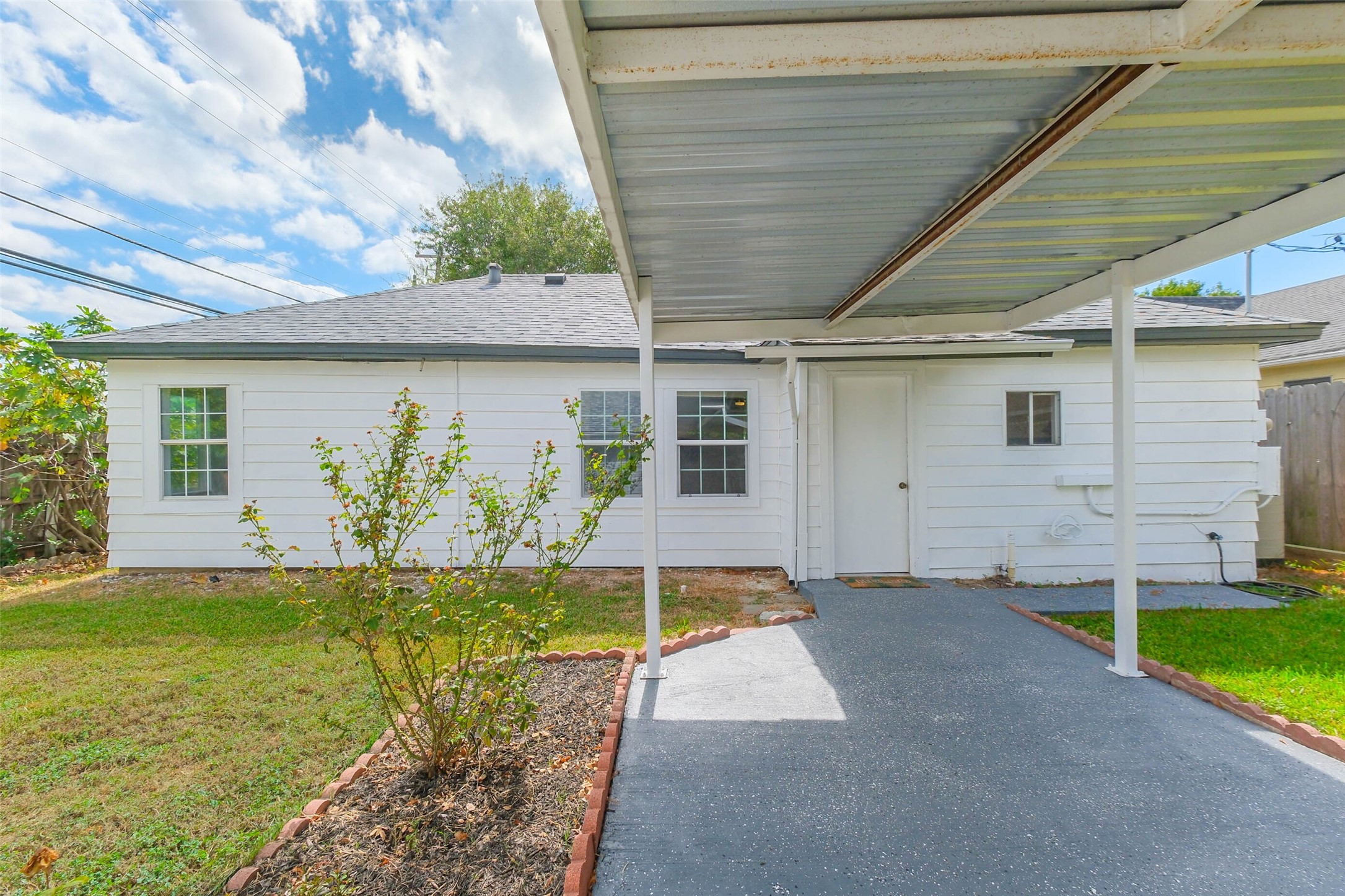 7543 Greenstone Street Houston, TX 77087 - Photo 17 of 24 a house with garden in front of it