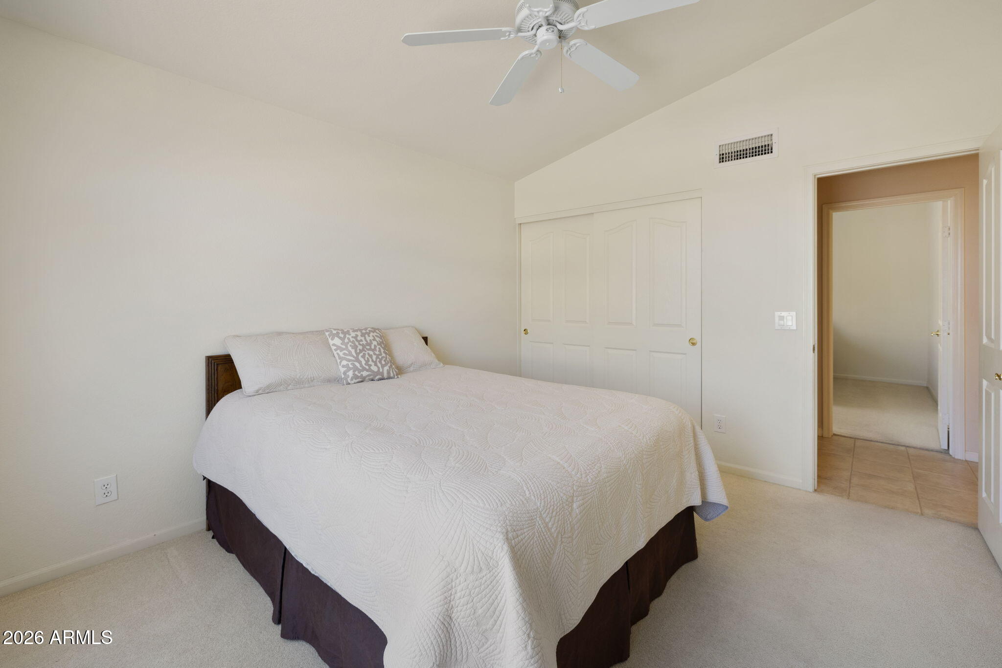 12435 West Monte Vista Road Avondale, AZ 85392 - Photo 33 of 69 a bedroom with a bed and ceiling fan