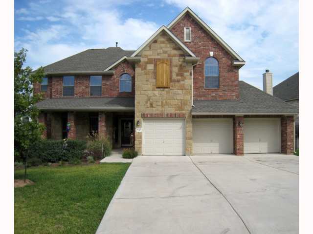 1015 Cavalry Ride Trail Austin, TX 78732 - Photo 1 of 1 a front view of a house with a garden