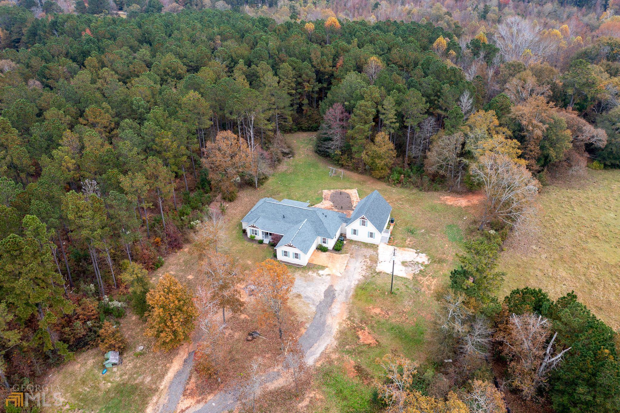 308 Cannafax Road Barnesville, GA 30204 - Photo 1 of 1 an aerial view of a house with a yard
