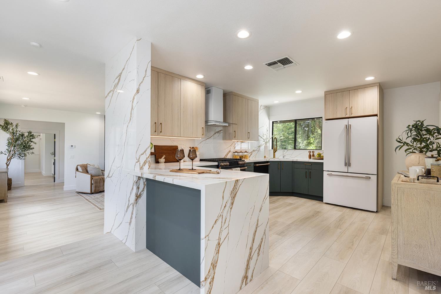 14734 Young Road Healdsburg, CA 95448 - Photo 28 of 47 a kitchen with a sink a refrigerator and a stove top oven