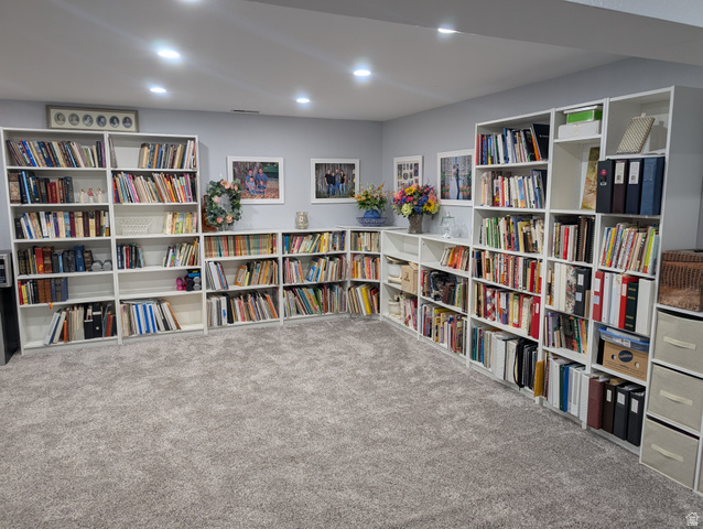 897 East 1200 North Mapleton, UT 84664 - Photo 50 of 54 Sitting room featuring carpet, wall of books, and recessed lighting