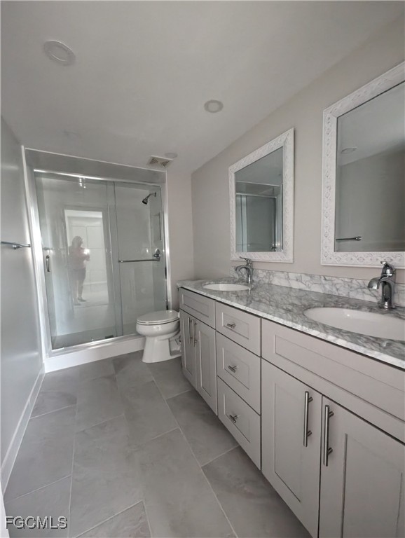 1519 Cape Coral Parkway West, Unit 8 Cape Coral, FL 33914 - Photo 15 of 19 a bathroom with a granite countertop sink mirror and toilet