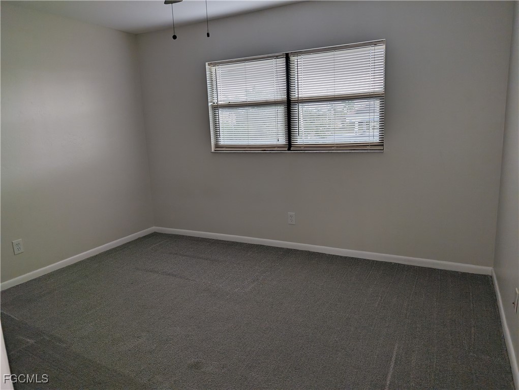 1519 Cape Coral Parkway West, Unit 8 Cape Coral, FL 33914 - Photo 16 of 19 an empty room with a window