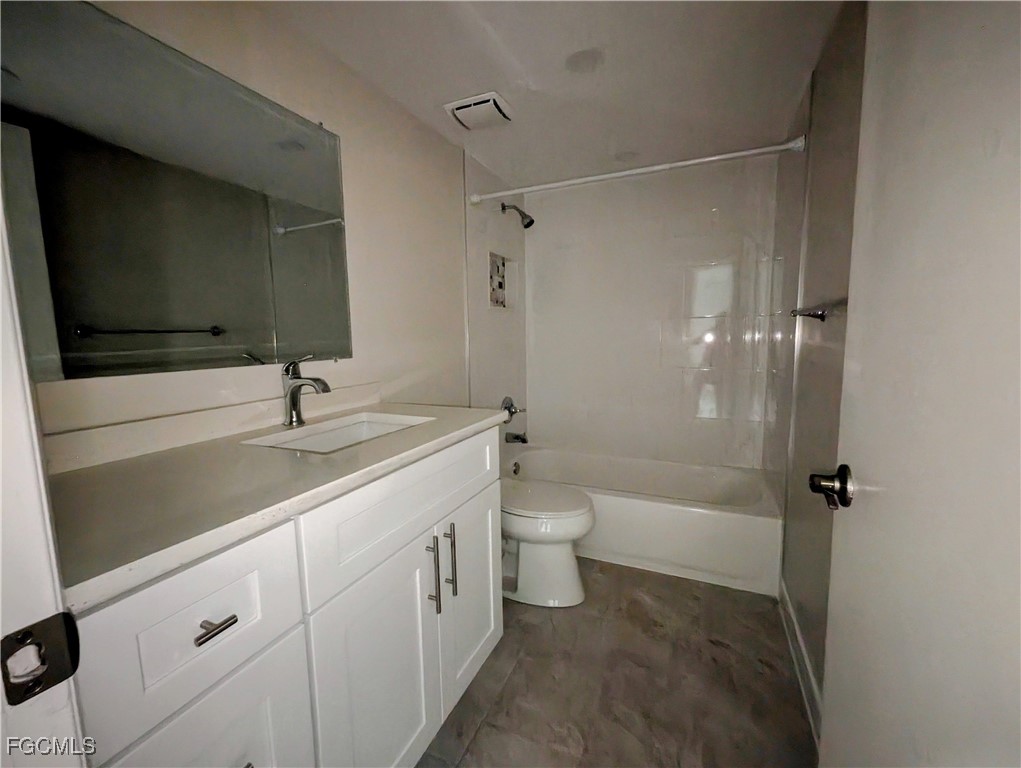 1519 Cape Coral Parkway West, Unit 8 Cape Coral, FL 33914 - Photo 18 of 19 a bathroom with a sink a toilet and shower
