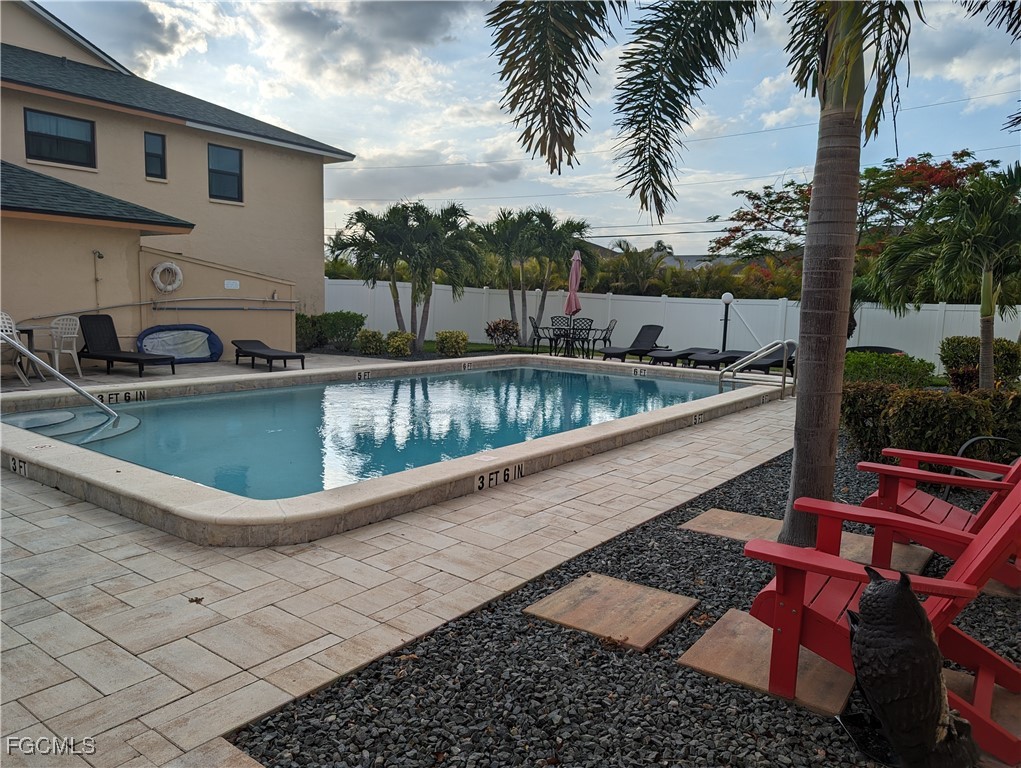 1519 Cape Coral Parkway West, Unit 8 Cape Coral, FL 33914 - Photo 19 of 19 a view of a swimming pool with a patio