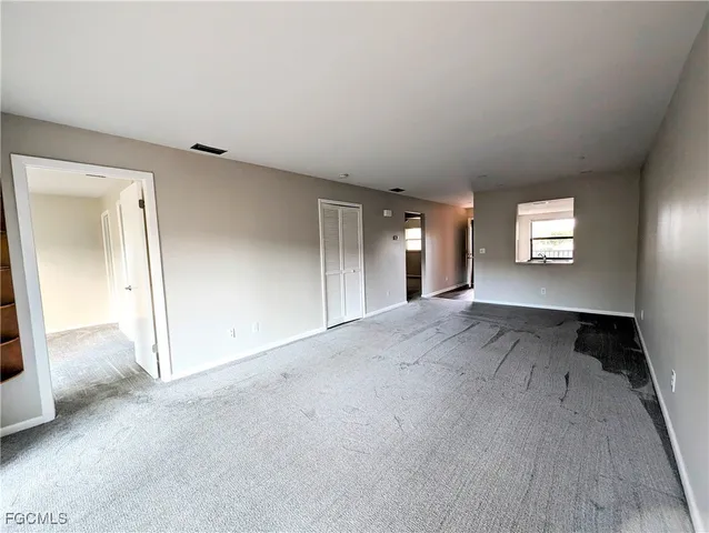 an empty room with windows