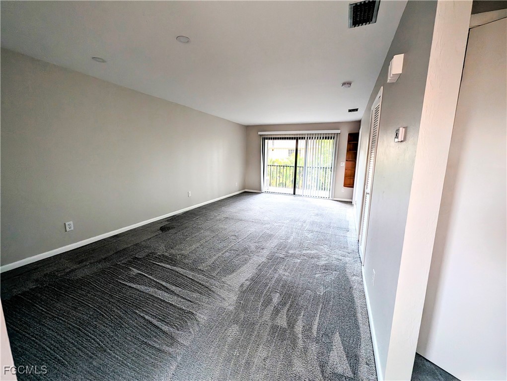1519 Cape Coral Parkway West, Unit 8 Cape Coral, FL 33914 - Photo 7 of 19 wooden floor in an empty room with a window