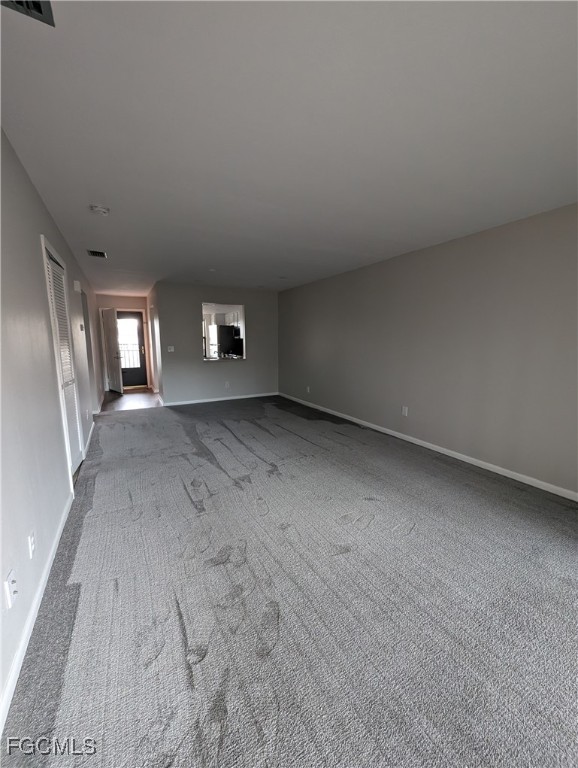 1519 Cape Coral Parkway West, Unit 8 Cape Coral, FL 33914 - Photo 8 of 19 an empty room with windows