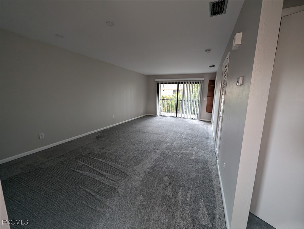 1519 Cape Coral Parkway West, Unit 8 Cape Coral, FL 33914 - Photo 9 of 19 an empty room with windows