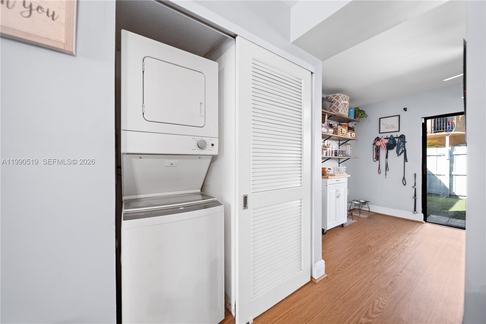 10206 Southwest 77th Court Miami, FL 33156 - Photo 11 of 28 a view of a hallway with wooden floor and closet