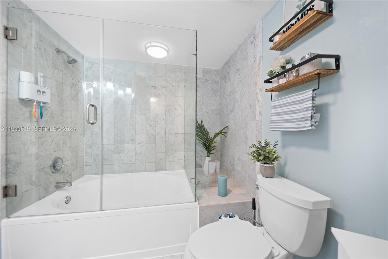 10206 Southwest 77th Court Miami, FL 33156 - Photo 18 of 28 a bathroom with a sink toilet and shower