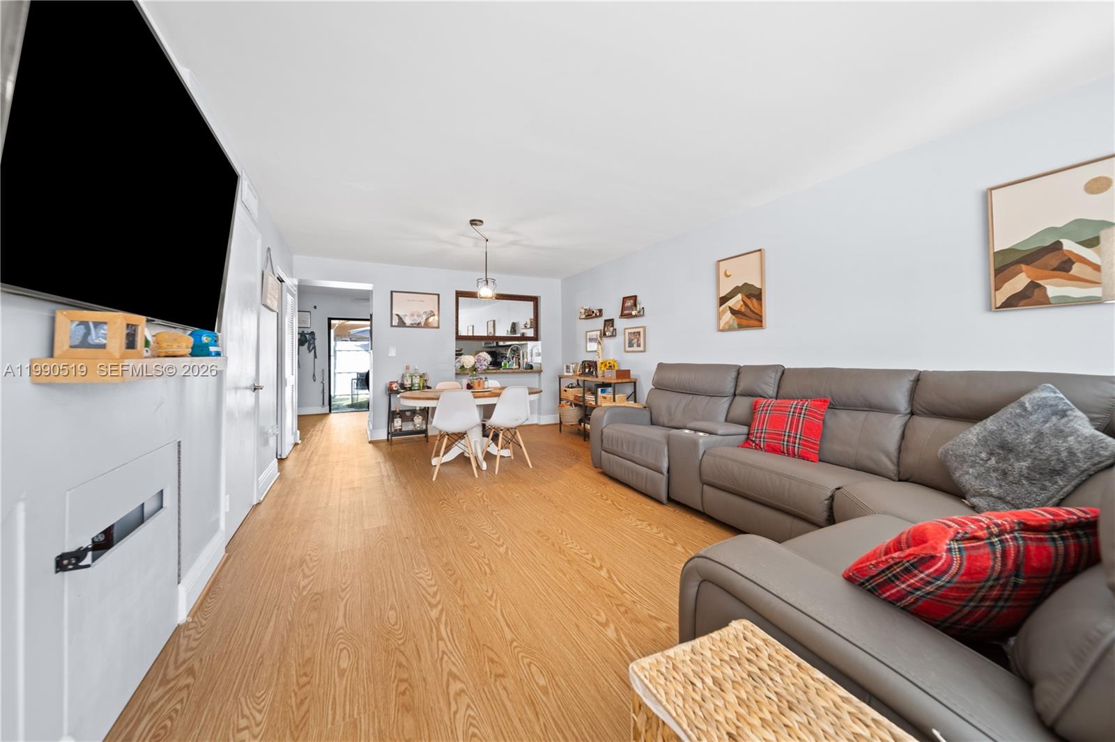 10206 Southwest 77th Court Miami, FL 33156 - Photo 3 of 28 a living room with furniture and a flat screen tv