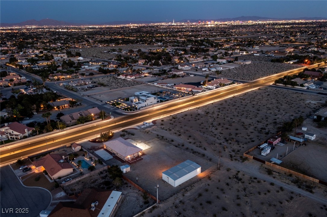 5315 North Fort Apache Road Las Vegas, NV 89149 - Photo 17 of 46 Aerial view at Dusk from The Northwest Corner of the Property through Modernized Fort Apache Road to the Beautiful Night Shot of The Vegas Strip.