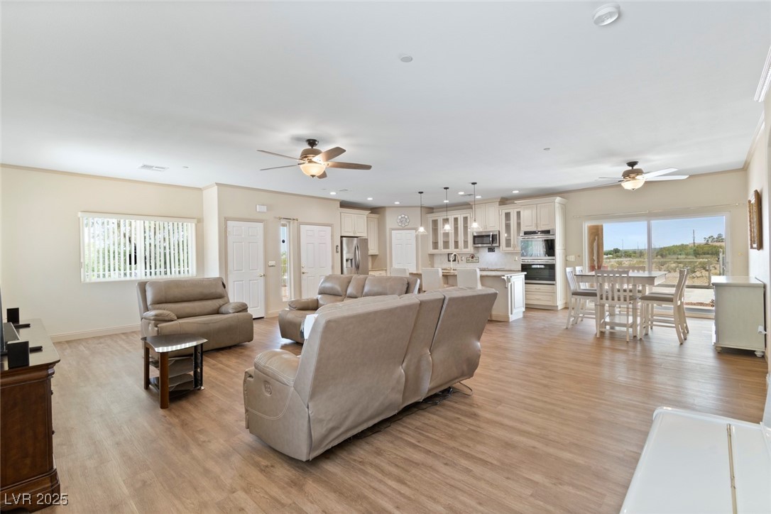 5315 North Fort Apache Road Las Vegas, NV 89149 - Photo 19 of 46 The Great Room comes furnished with Ashley Furniture's Plug in Couches.