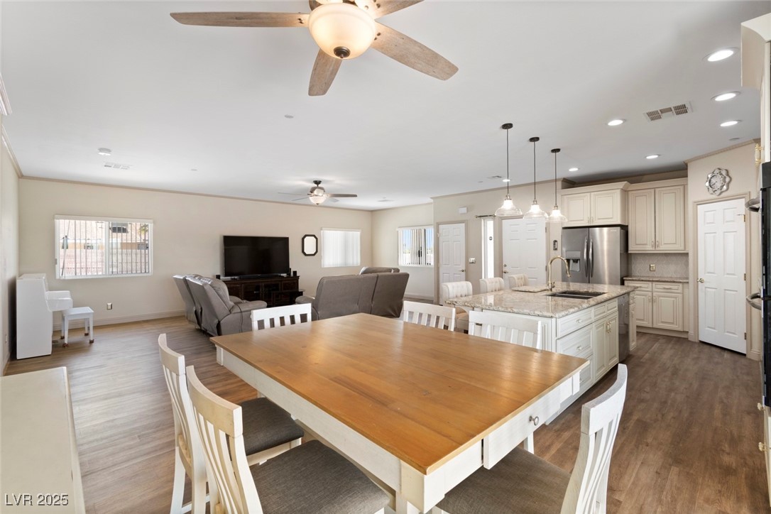 5315 North Fort Apache Road Las Vegas, NV 89149 - Photo 22 of 46 From The Dining Space, featuring this Great Room, including an Entertainment Center, with a 75" Samsung Flat Screen.