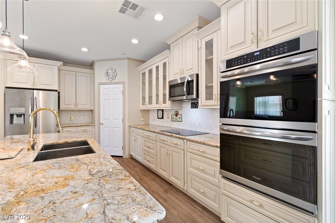 5315 North Fort Apache Road Las Vegas, NV 89149 - Photo 25 of 46 Kitchen with Frigidaire Model # FGET3069UF Frigidaire Gallery 30'' Double Electric Wall Oven With Air Fry. Also seen is the Electric Countertop Stove and Microwave.