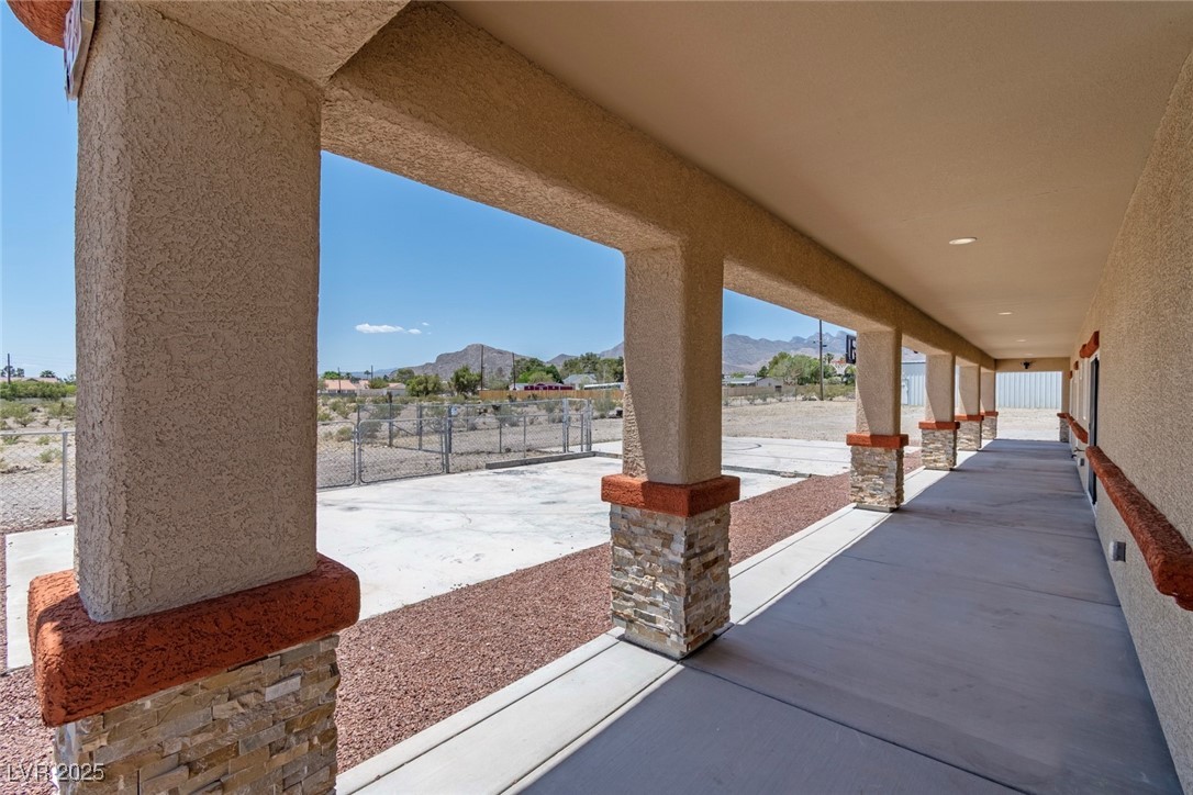 5315 North Fort Apache Road Las Vegas, NV 89149 - Photo 38 of 46 South Side 77 X 8 Foot Covered Patio. Outside of Patio is Extra Concrete for Possible Parking & Basketball play area.