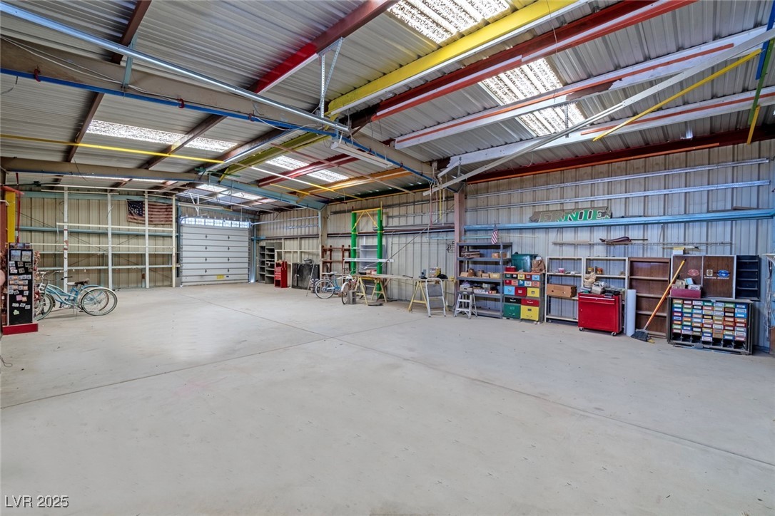 5315 North Fort Apache Road Las Vegas, NV 89149 - Photo 43 of 46 1800 SF Metal Garage, with Shelving throughout for storage.