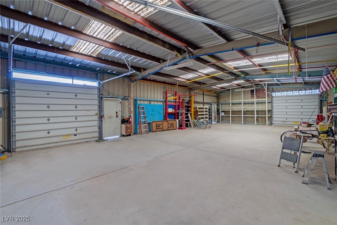 5315 North Fort Apache Road Las Vegas, NV 89149 - Photo 44 of 46 1800 SF Metal Garage with two Spring Roll Up Garage Doors and two heavy duty doors.