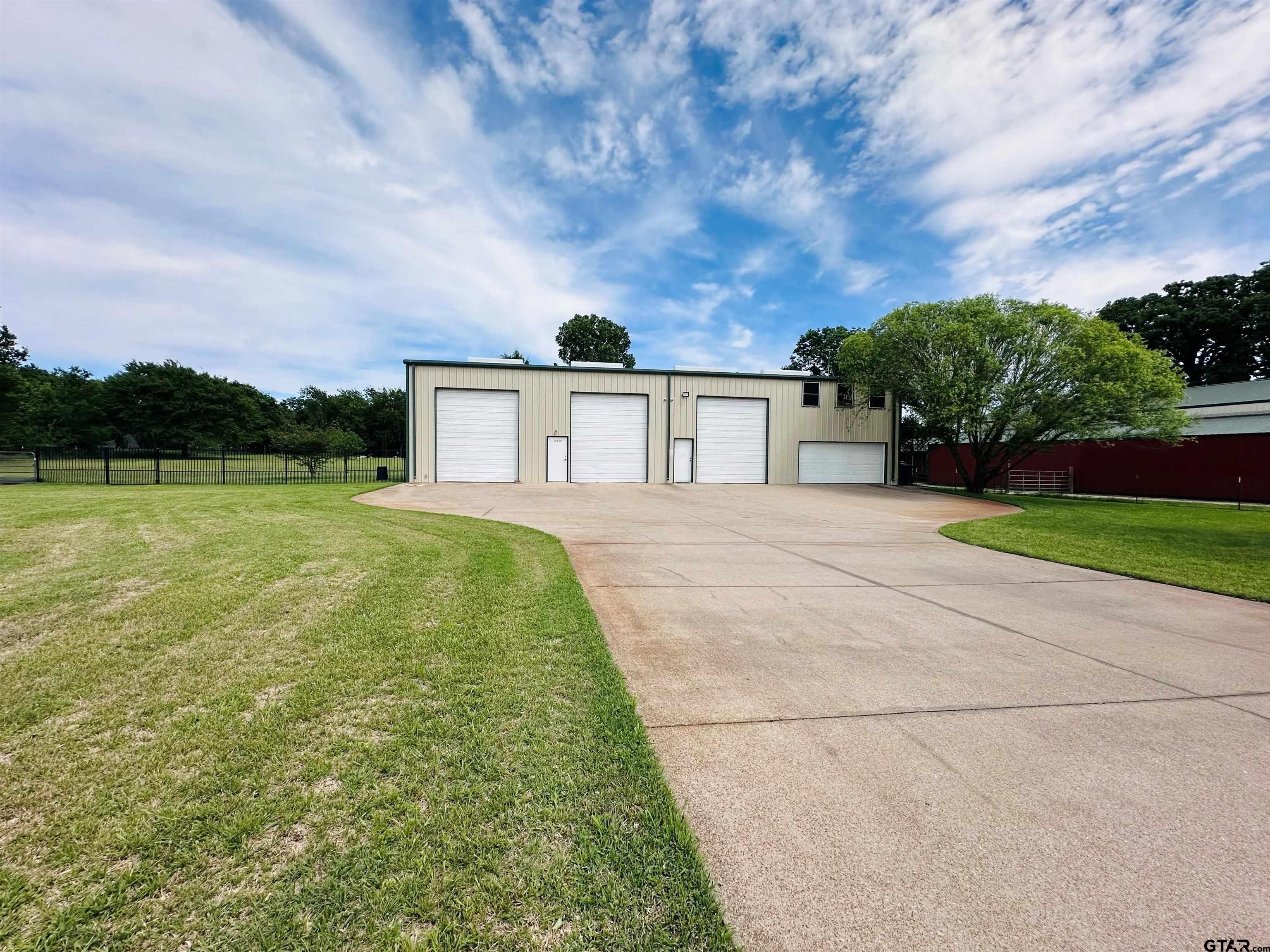 6454 Clear Creek Road Mabank, TX 75156 - Photo 1 of 17 a view of a backyard with plants and large trees